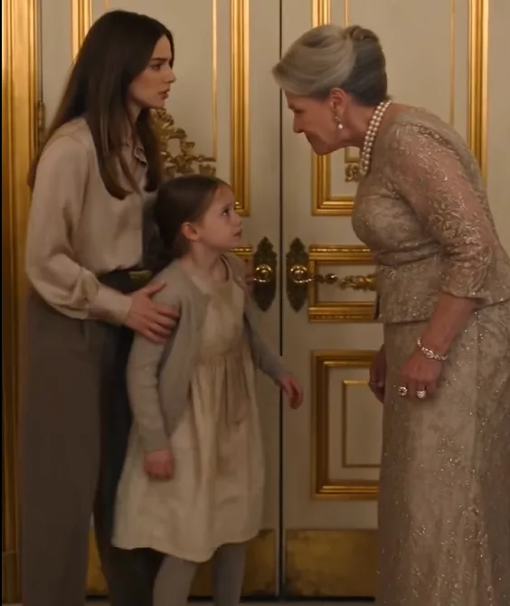 Helena grabs Sophie’s arm near the ballroom entrance and forcefully pushes her back toward the doors.
