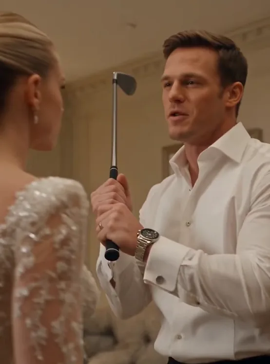 Inside the private bridal suite, Preston locks the door and raises the metal golf club toward Giulietta.