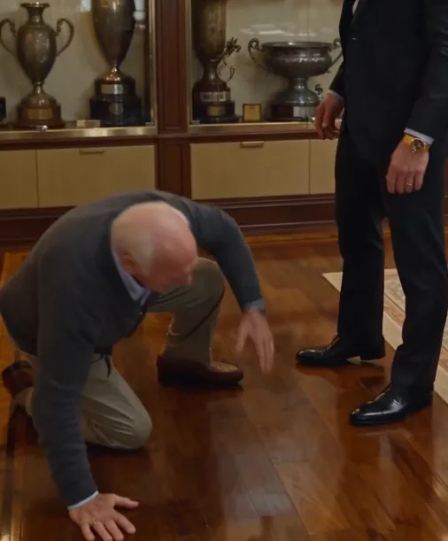 Marcus violently snatches Arturo’s wooden cane away and throws it across the trophy-room carpet.