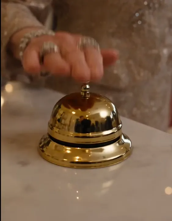 Helena Caruso rang the little brass bell and watched three-year-old Lily hurry across the reception carrying folded napkins in filthy clothes.