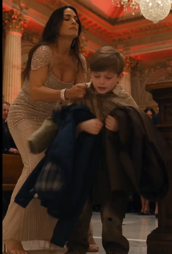 Bianca Hayes shoved three-year-old Noah Bellacorte against the coat table while his tiny arms disappeared beneath a pile of guests’ jackets.