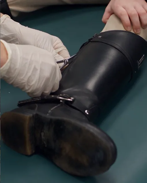 Six-year-old Lily was shaking on the examination bench while Dr. Emma prepared to cut open her riding boot.