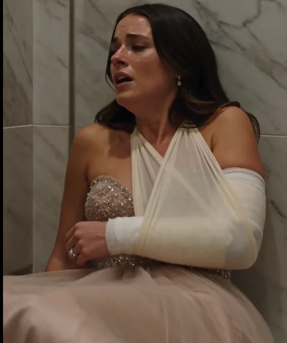Sylvia Grimaldi was trapped behind a locked bathroom door with one arm already in a sling.