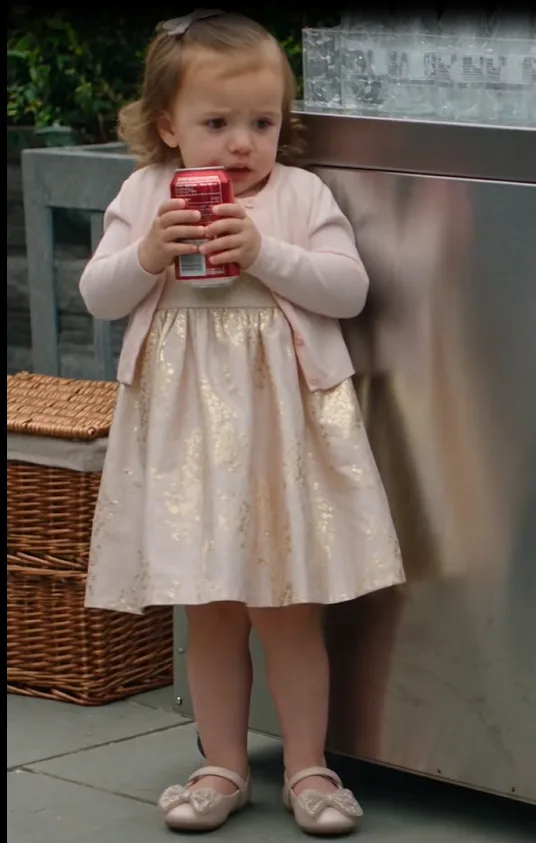 At a private Carbone garden luncheon, three-year-old Lily crouched beside an open cooler with a cold soda can in her hands when Gerald began snapping a leather belt against the stone only inches from her.