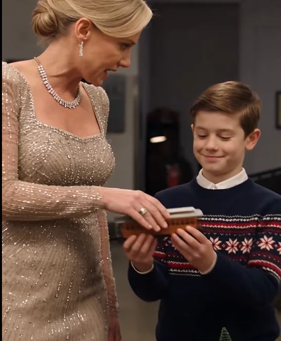 Four-year-old Theo reached for a small wooden locomotive at the family holiday gala.