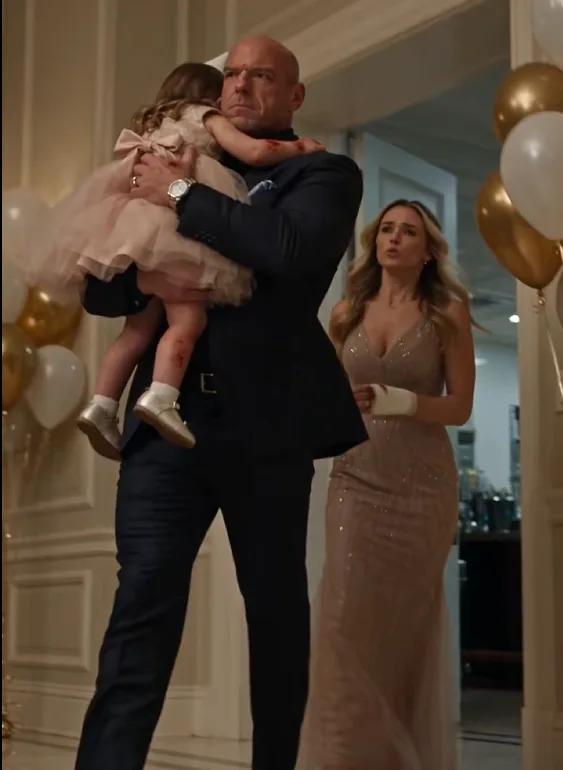 Alex returned to Rosie’s birthday dinner carrying his three-year-old daughter against his chest, her small hands red and irritated.