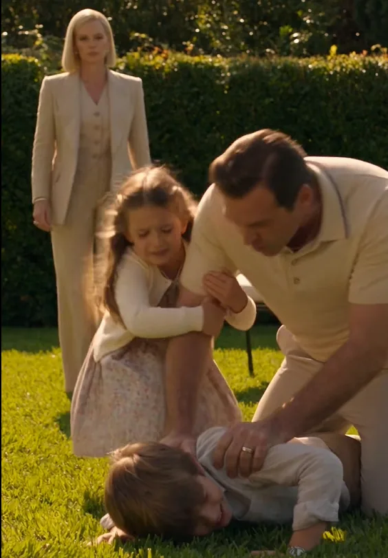 Nolan had six-year-old Leo pinned face-down on the lawn when Serafina reached them.