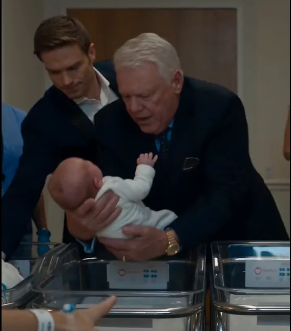 Victor Mercer lifted one of Sofia Ravelli’s newborn babies out of the bassinet.