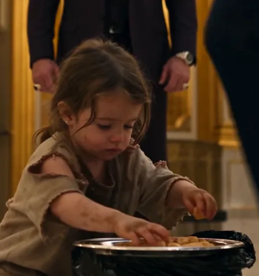 Behind the ballroom, four-year-old Emma Bellandi was pulling untouched sweet rolls from a catering trash bag and arranging them carefully onto a tray.