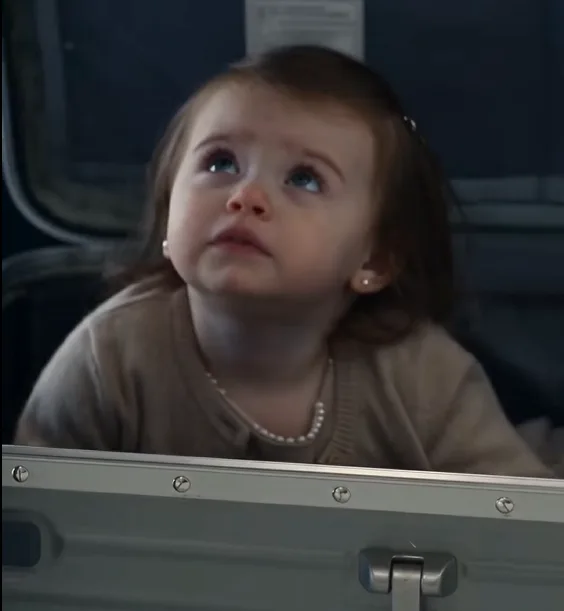 The large hard-shell travel case beside the private jet suddenly began shaking.