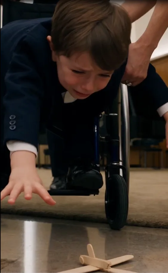 Three-year-old Nico Greco proudly held out the handmade wooden airplane he had wrapped himself.