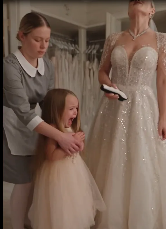 Bianca Moretti stood beside the bridal makeup table with electric clippers in her hand.