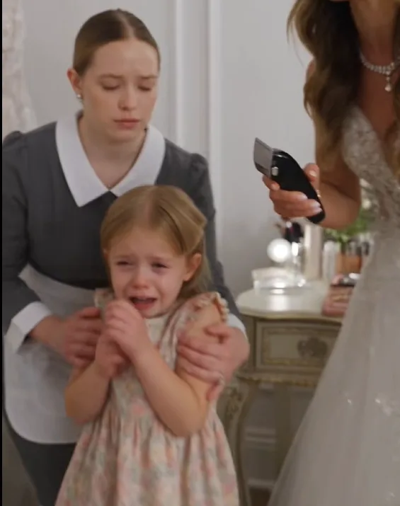 Bianca was running electric clippers through three-year-old Livia’s hair when Rosalie rushed in to shield the child.