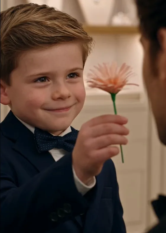 Four-year-old Noah proudly offered Grant a handmade paper flower.