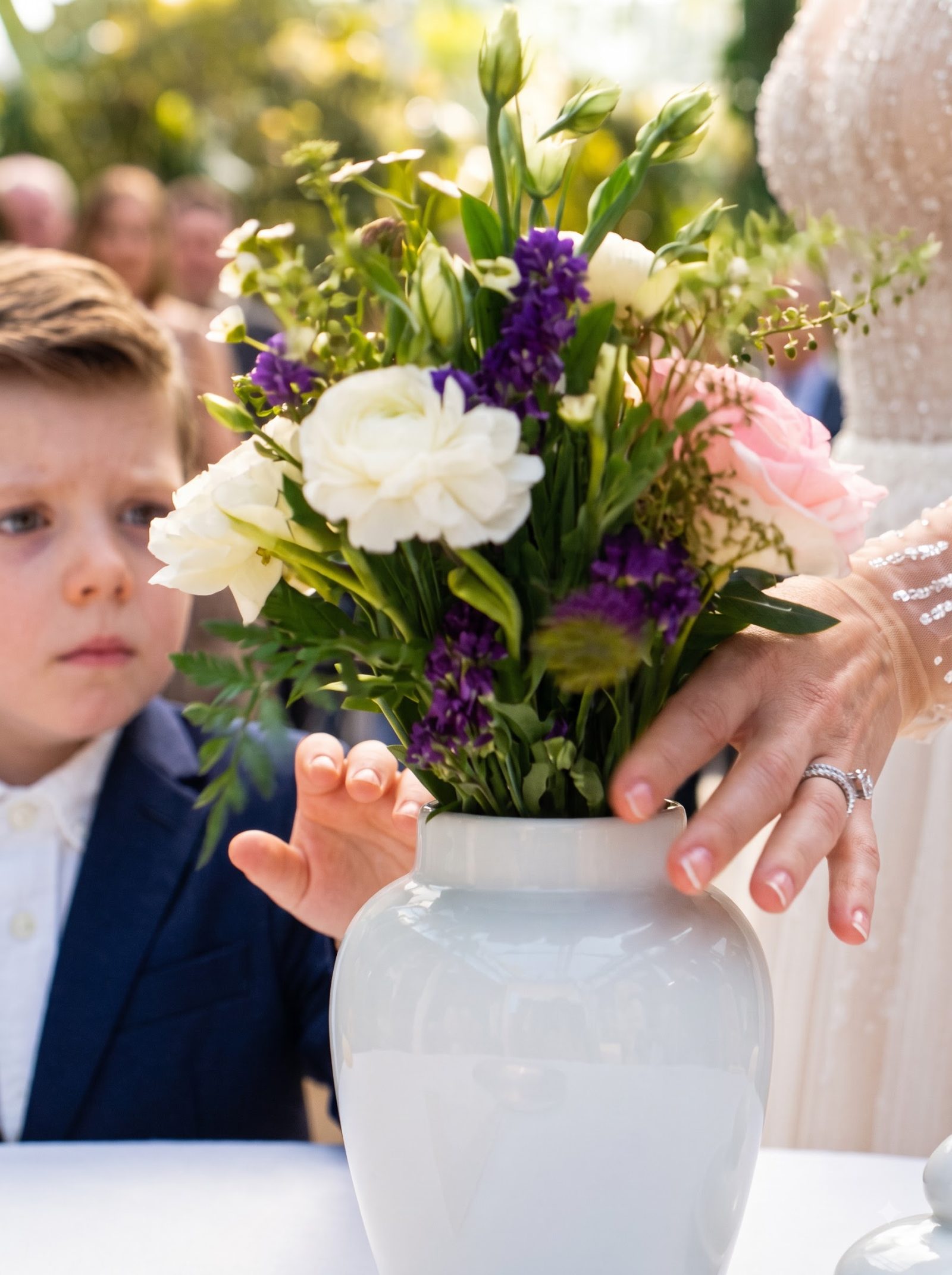 Verena pushed a bouquet into the open memorial urn belonging to Alden’s late wife and deliberately moved the lid away when six-year-old Milo reached for it.