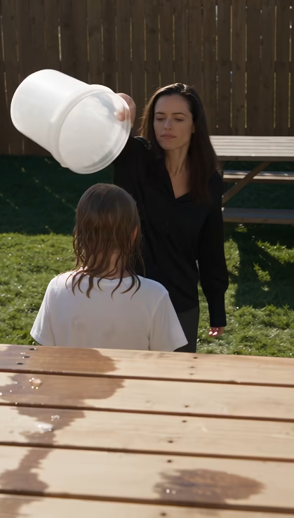 I pulled into my ex-husband’s driveway just as his new wife dumped an entire bucket of ice water over our nine-year-old daughter—and what happened when he came home seconds later changed everything.