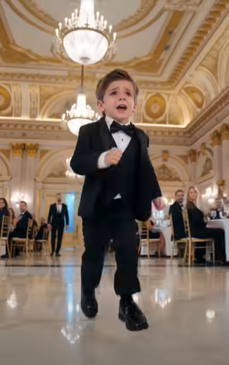 238 A lavish wedding reception was underway when a little boy in a tuxedo suddenly ran across the ballroom screaming, "Mommy!"